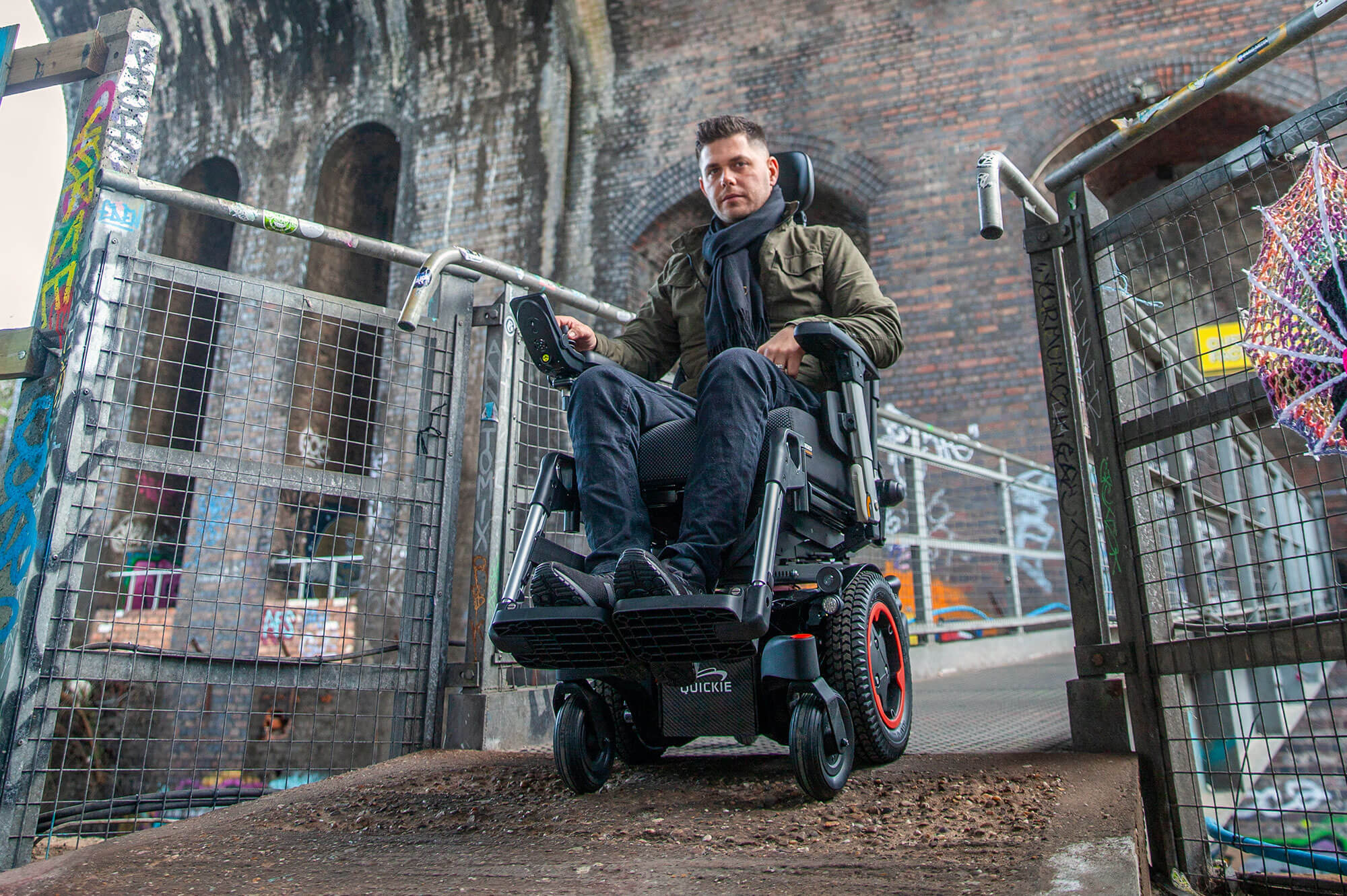 Quicki Q300 M Mini traveling on rough terrain narrow powerchair