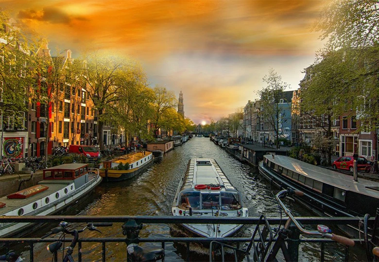 Explore the scenic canals of Amsterdam